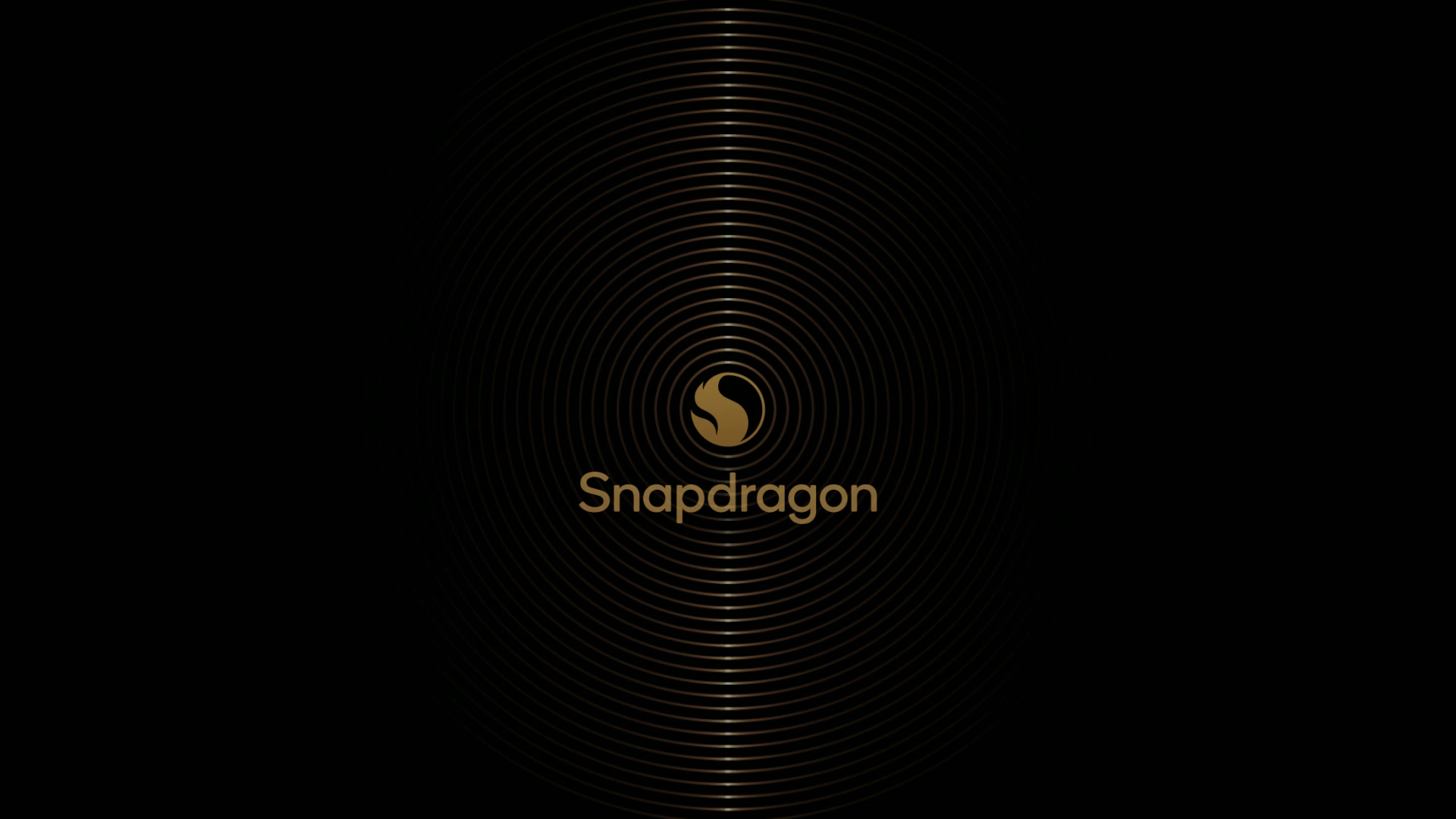 Snapdragon vehicle start-up animation — gold Snapdragon Fireball mark inside concentric gold rings on a black cockpit display