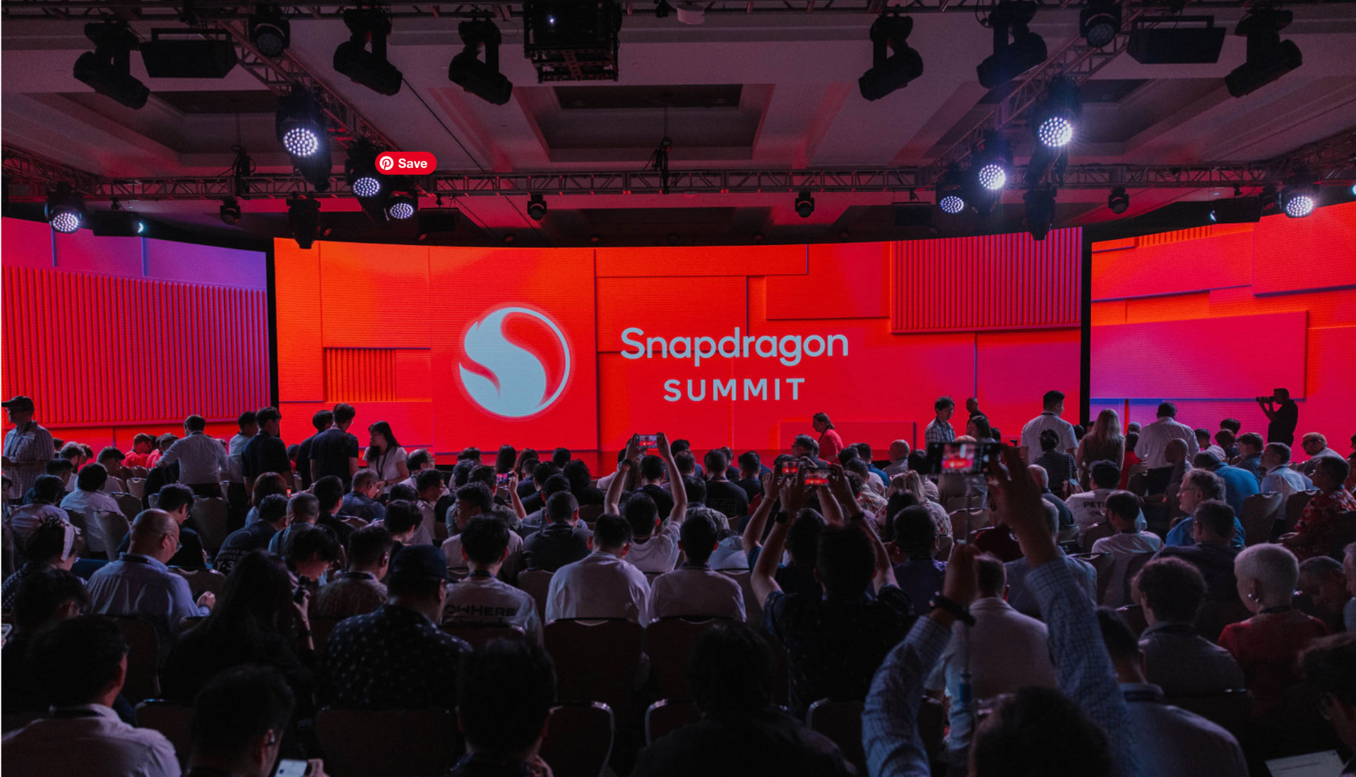 Snapdragon Summit main stage — 3D Snapdragon Fireball glowing against deep red gradient backdrop