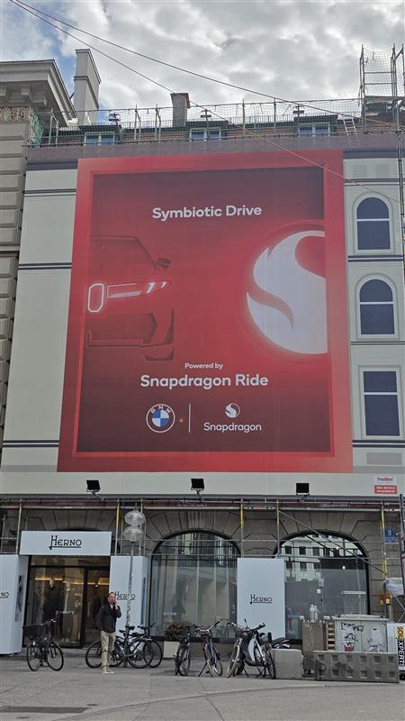 BMW driving through Munich in midday daylight