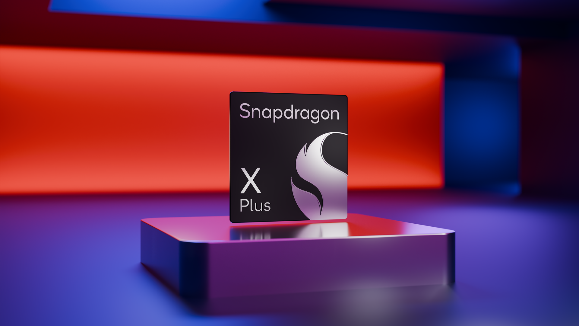 Snapdragon X Plus 10-core chip badge on a pedestal with red and blue studio lighting